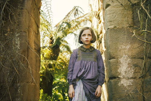 Mary (Dixie Egerickx) discovers a magical garden in THE SECRET GARDEN